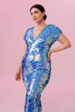 Dark haired model with hair tied back wearing a Rosa Bloom sequin Aphrodite jumpsuit in Amethyst