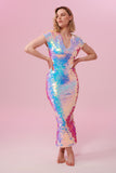 A woman facing towards you at a slight angle wearing an opal sequin long figure hugging dress with small capped sleeves covered in large round holographic purple, pink, blue and white coloured Rosa Bloom sequins. The sequins glisten, creating a mix of shimmering colours of pink, blue, lilac and white. 