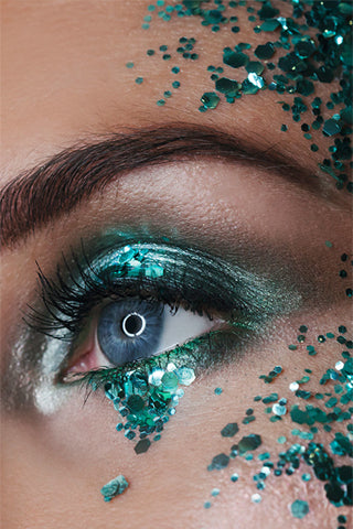 Close up detail of an eye with aqua trip cosmetic biodegradable glitter detailing