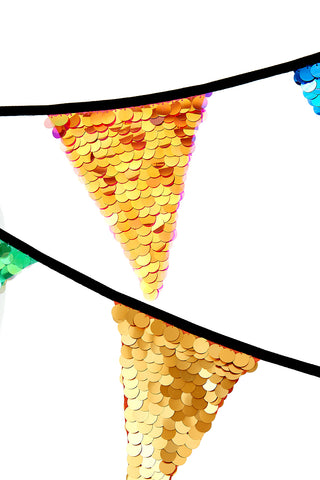 A close up image of multicoloured sequin bunting from Rosa Bloom