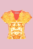 Stretchy capped sleeve festival sequin top covered in large round holographic Rosa Bloom sequins. The Fox sequins sparkle in the light, creating a mix of shimmering colours of gold and orange. 