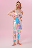 Front view of a woman wearing a white opal sequin Rosa Bloom jumpsuit