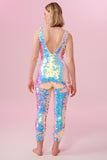 Rear view of a woman wearing a white opal sequin Rosa Bloom jumpsuit