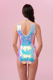 Long brown haired model posing with their back to the camera wearing an Opal coloured Rosa Bloom Sequin Fifi Leotard