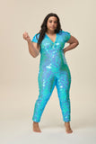 Front view of a woman wearing the Rosa Bloom Aphrodite jumpsuit embellished in hand sewn sparkly aqua blue sequins. 