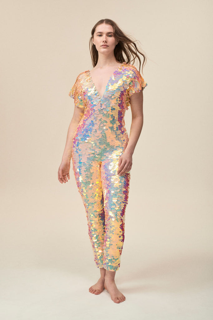Front view of a woman wearing the Rosa Bloom Aphrodite jumpsuit embellished in hand sewn sparkly quartz pearl white sequins.