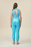 A back view of a woman wearing a high neck aqua blue sequin jumpsuit with a keyhole back detail. 