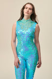 A close up shot of a woman wearing an aqua blue sequin jumpsuit with a high neck.